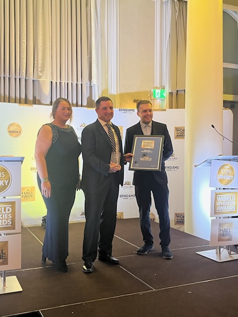 Co-Founder Tommy Erwin accepting the award with representatives of the World Whiskey Awards